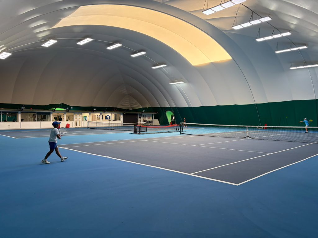 Indoor tennis courts at The Hill Racquets Club