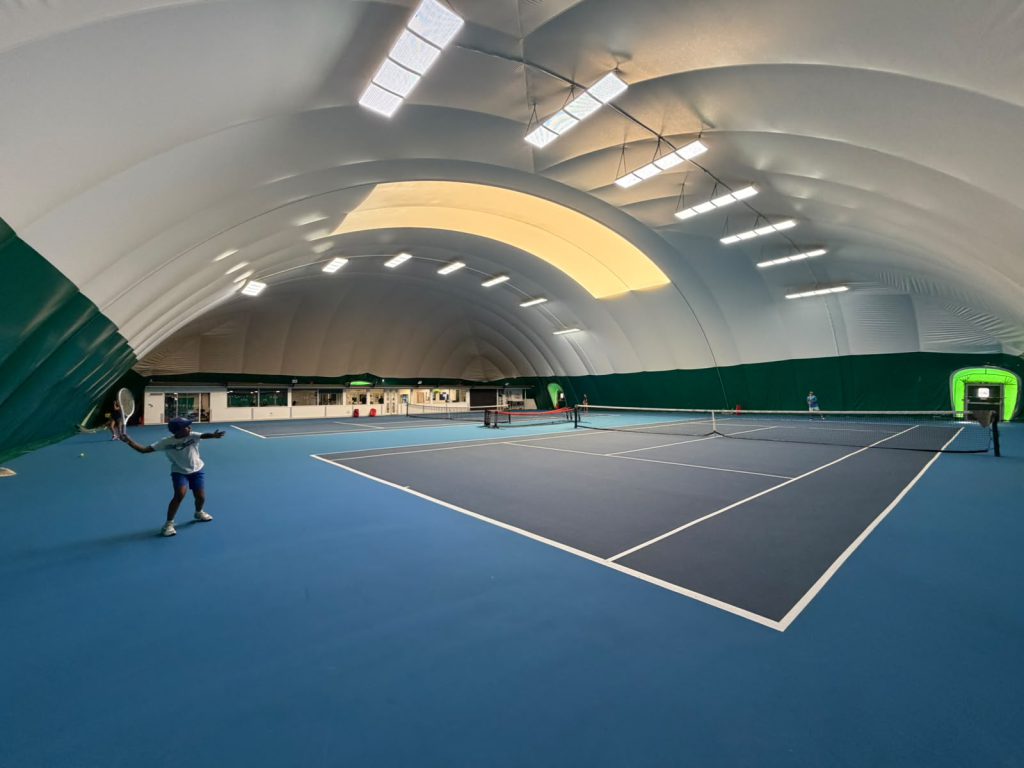 Indoor tennis courts at The Hill Racquets Club