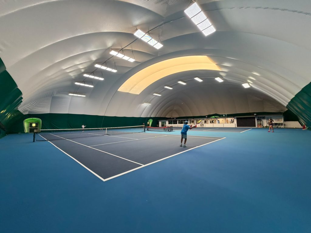 Indoor tennis courts at The Hill Racquets Club