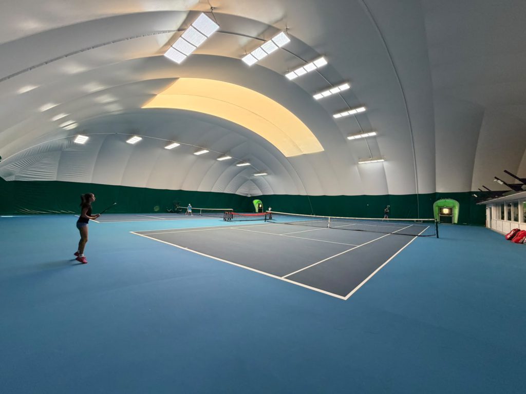 Indoor tennis courts at The Hill Racquets Club