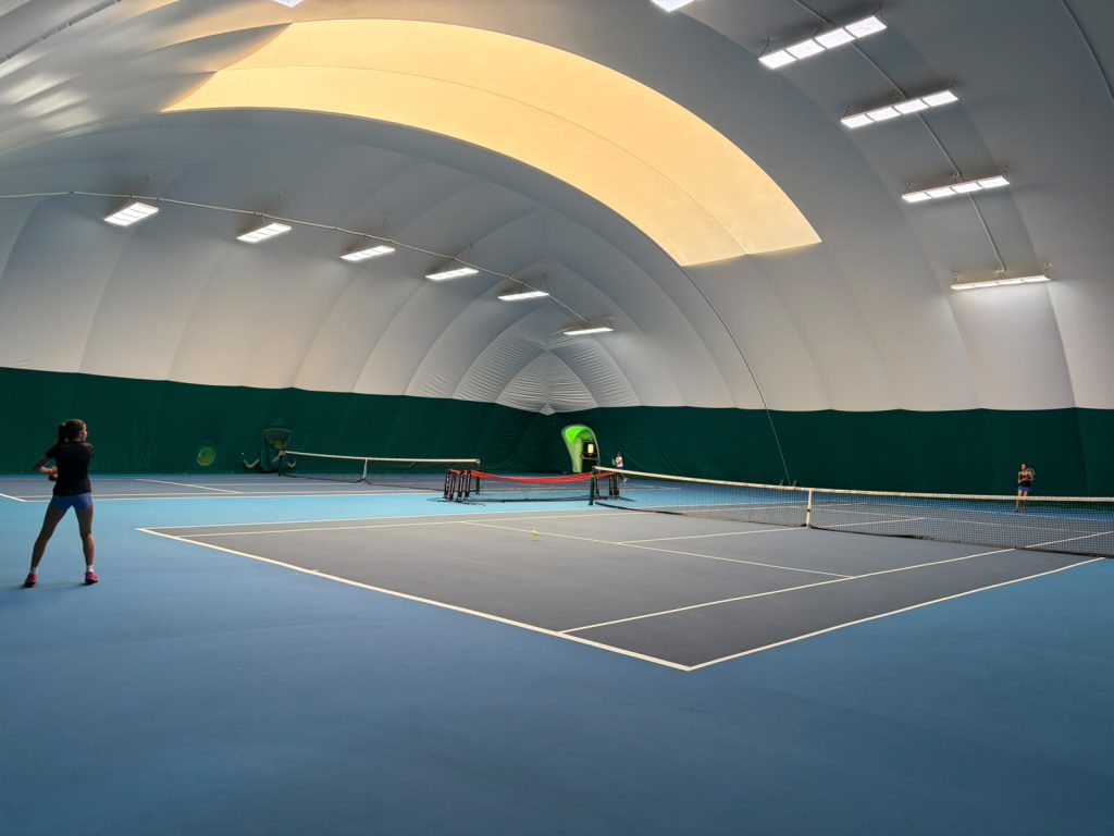 Indoor tennis courts at The Hill Racquets Club