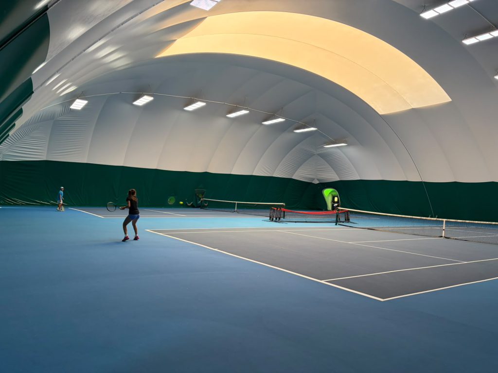 Indoor tennis courts at The Hill Racquets Club