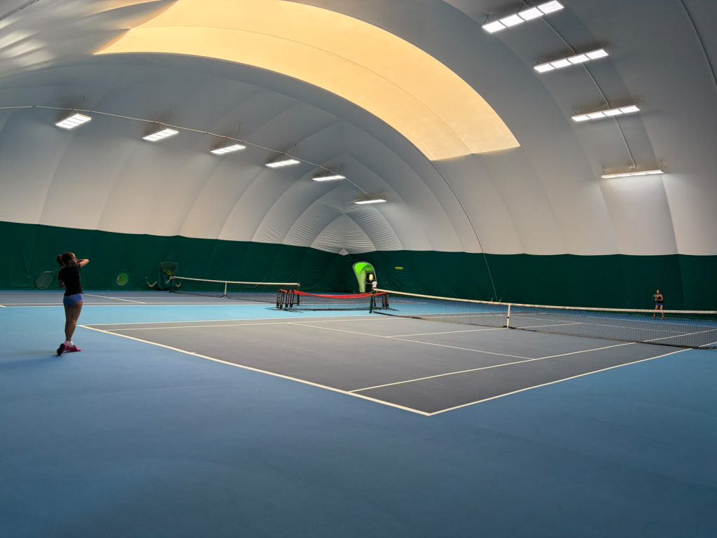 Indoor tennis courts at The Hill Racquets Club