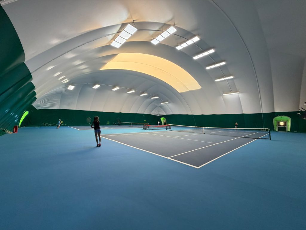 Indoor tennis courts at The Hill Racquets Club