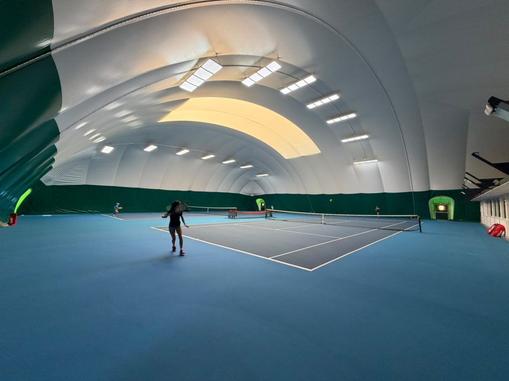 Indoor tennis courts at The Hill Racquets Club